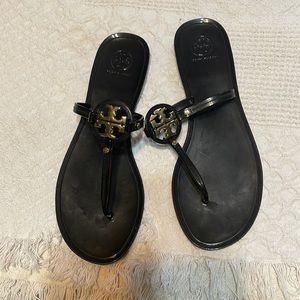 Black Tory Burch sandals with gold buckle